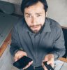 Man in Black Dress Shirt Holding Black Smartphone