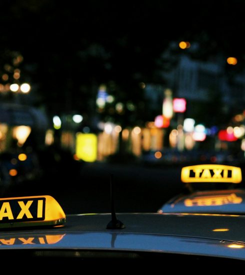 shallow focus photography of Taxi signage