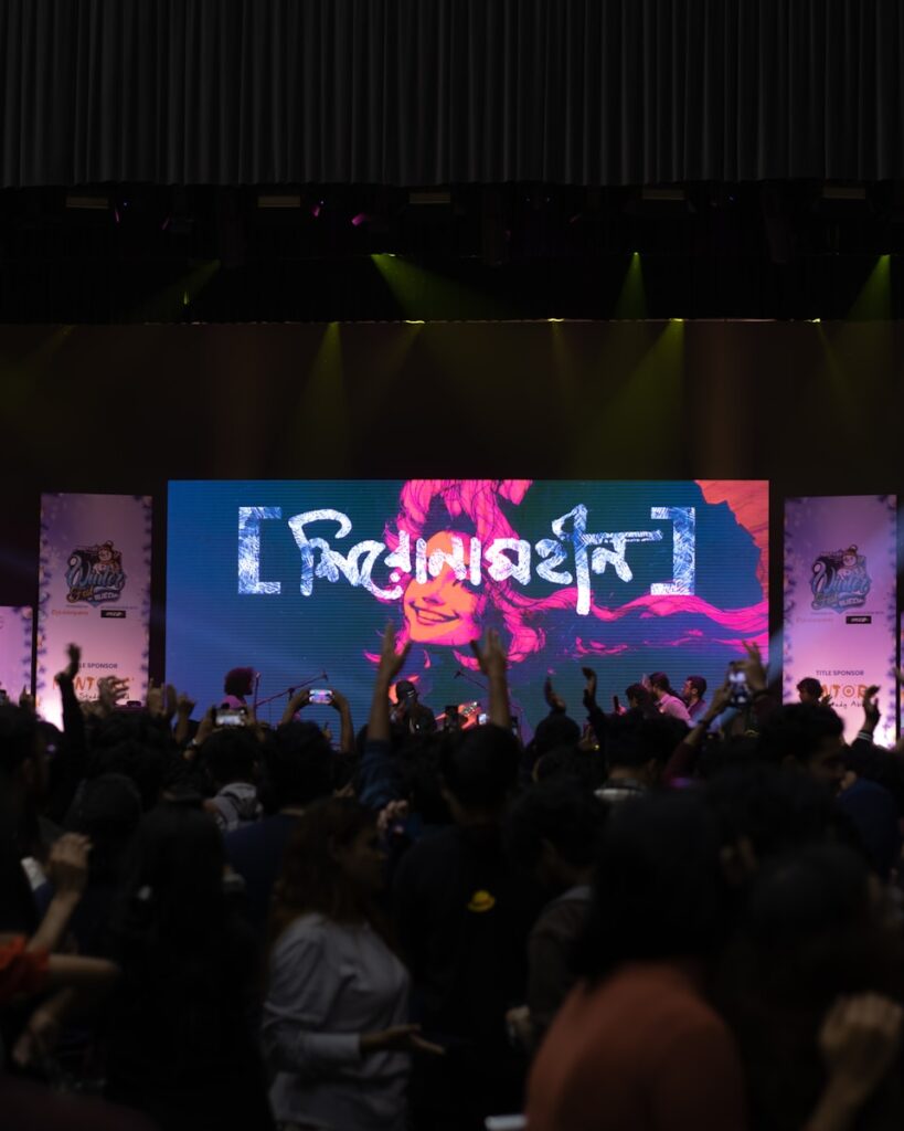 A crowd of people standing on top of a stage